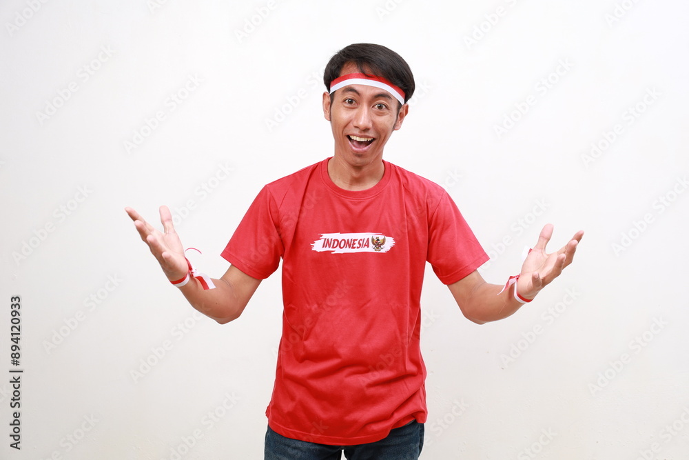Happy wow Surprised asian young boy with red white ribbon celebrating Indonesia independence day while looking camera Happy wow Surprised asian young boy with red white ribbon celebrating Indonesia independence day while looking camera