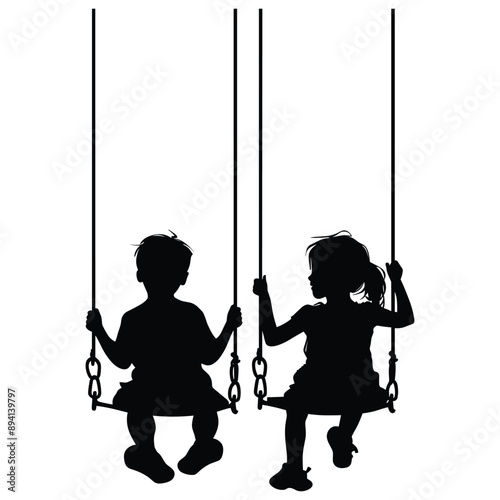 Silhouette of two children swinging on a playground swingset