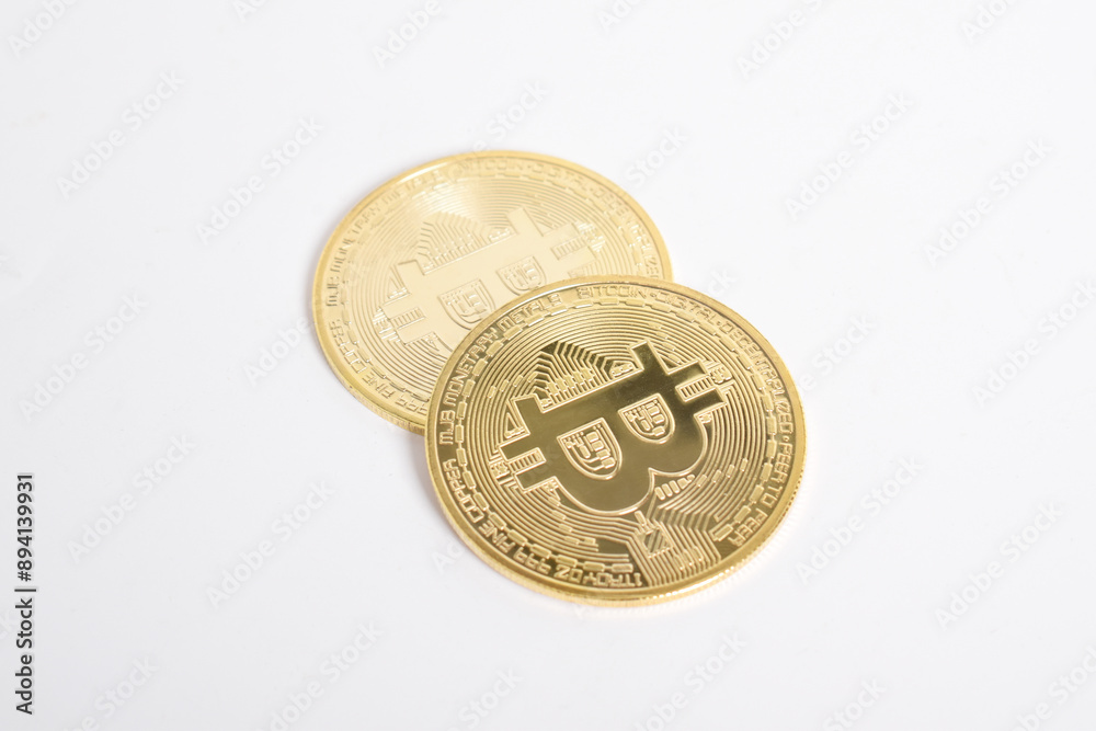 Bitcoin isolated on white background. Cryptocurrency. Golden bitcoin physical gold coin. Symbol of the crypto currency Bitcoin isolated on white background. Cryptocurrency. Golden bitcoin physical gold coin. Symbol of the crypto currency