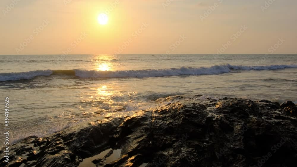Wave crushing stone on a sea shore. Wave crushing stone on a sea shore.