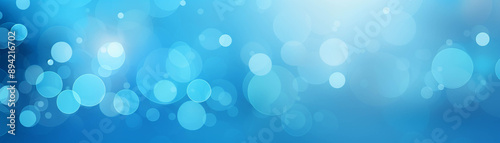blue bokeh background with light circles. Ideal for festive, celebration, or holiday themes with a bright and cheerful vibe.