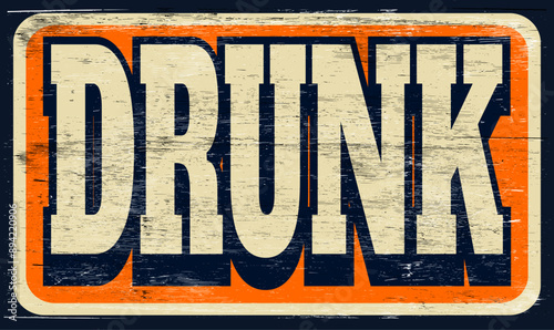Aged and worn drunk sign on wood