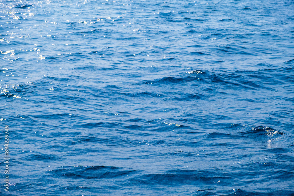 Ocean sea background and the clear sky For summer vacation ideas Nature of summer sea water with sunlight The sea sparkles against the blue sky Ocean sea background and the clear sky For summer vacation ideas Nature of summer sea water with sunlight The sea sparkles against the blue sky