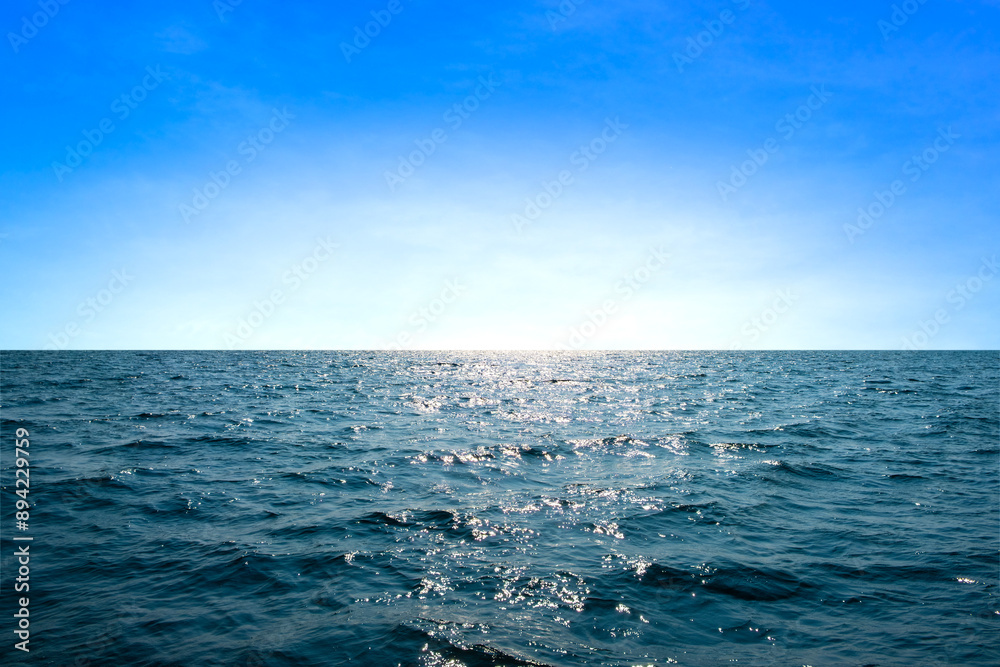 Fototapeta premium Ocean sea background and the clear sky For summer vacation ideas Nature of summer sea water with sunlight The sea sparkles against the blue sky