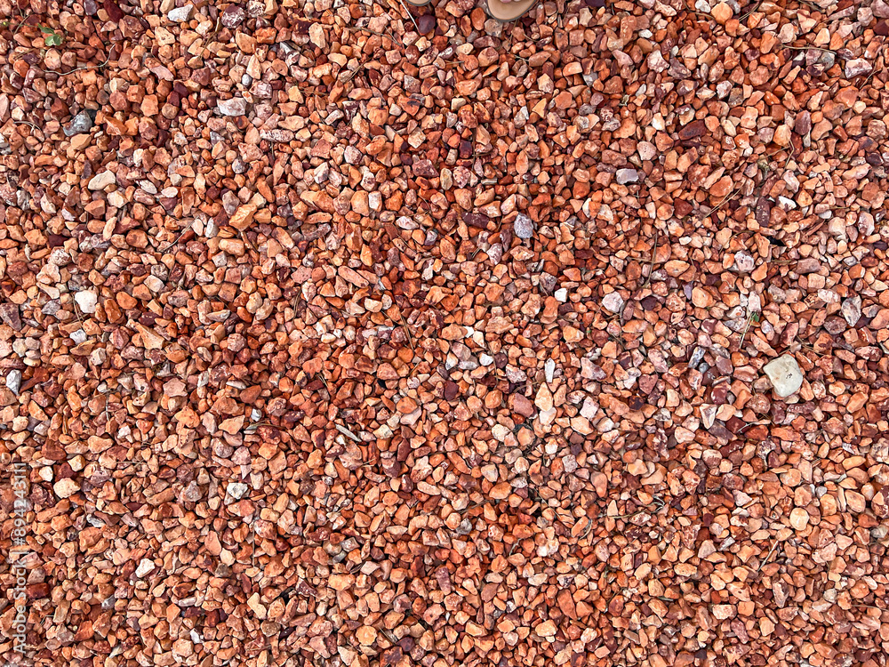red stone pebbles background, top down view, red stone pebbles background, top down view,
