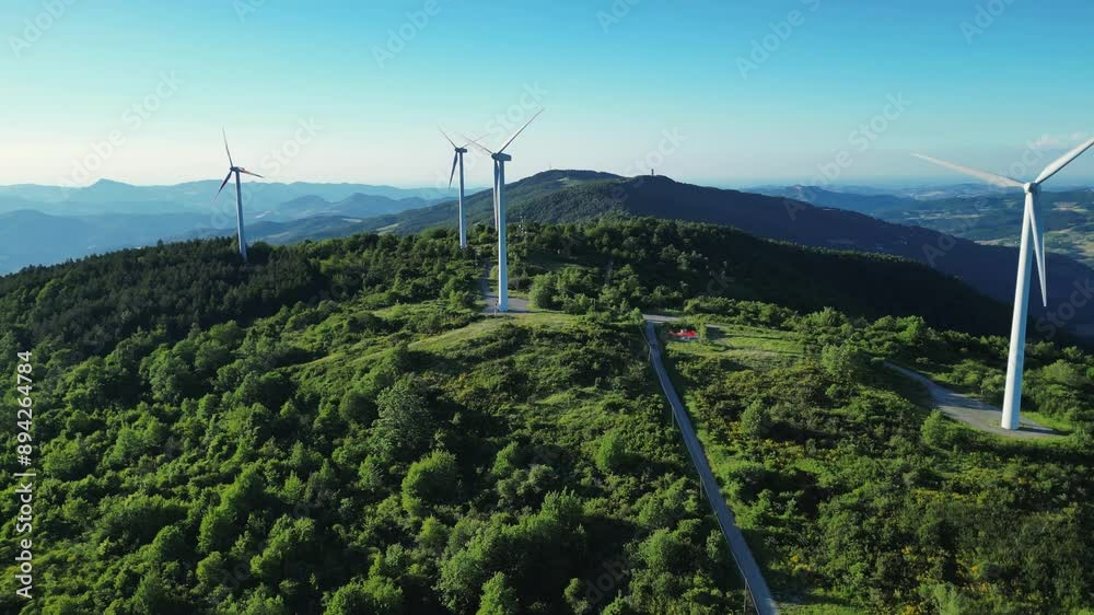 Panoramic view of wind farm or wind park, with high wind turbines for generation electricity with copy space Panoramic view of wind farm or wind park, with high wind turbines for generation electricity with copy space