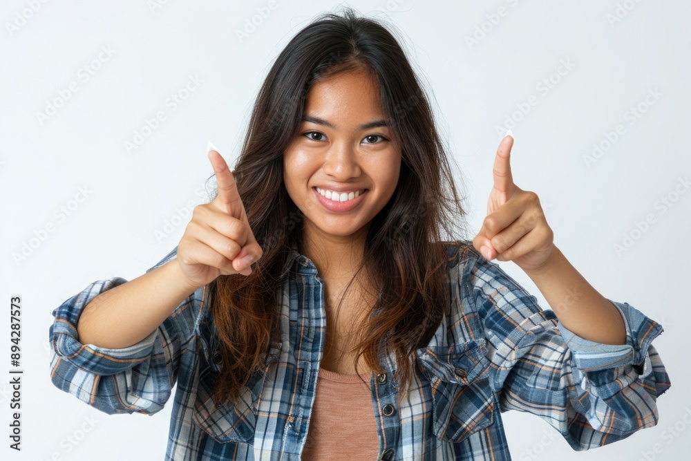 Asian woman pointing down inviting to follow white background. Asian woman pointing down inviting to follow white background.