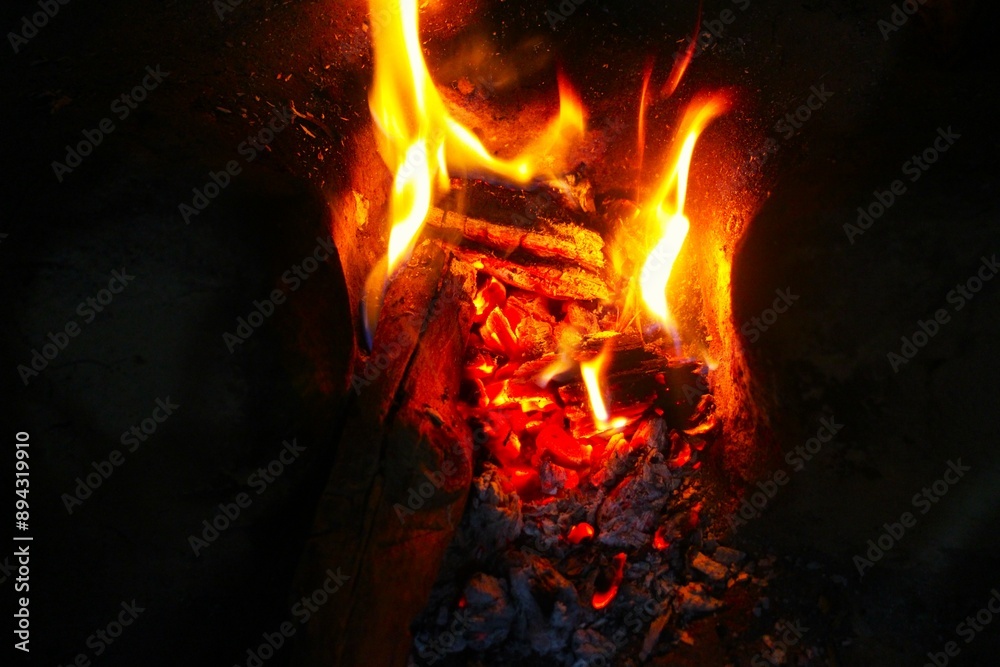 Close-up bonfire. Flames, ember and burning log of wood. Close-up bonfire. Flames, ember and burning log of wood.