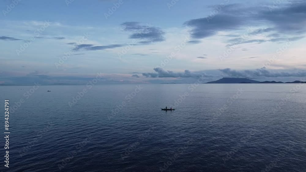 small fishing boat on the open sea fishing at dawn aerial view small fishing boat on the open sea fishing at dawn aerial view