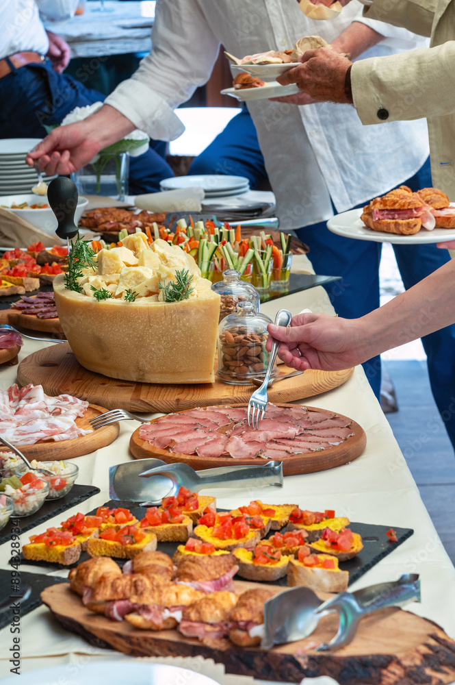 Obraz premium Guests are helping themselves at a catered event
