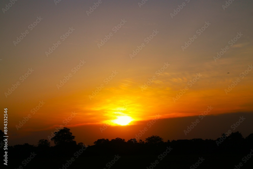 Sunset Sky Clouds in the evening with Red, Orange, Yellow and purple sunlight on Golden hour after sundown, Romantic sky in summer on Dusk Twilight. heart sky. Sunset Sky Clouds in the evening with Red, Orange, Yellow and purple sunlight on Golden hour after sundown, Romantic sky in summer on Dusk Twilight. heart sky.