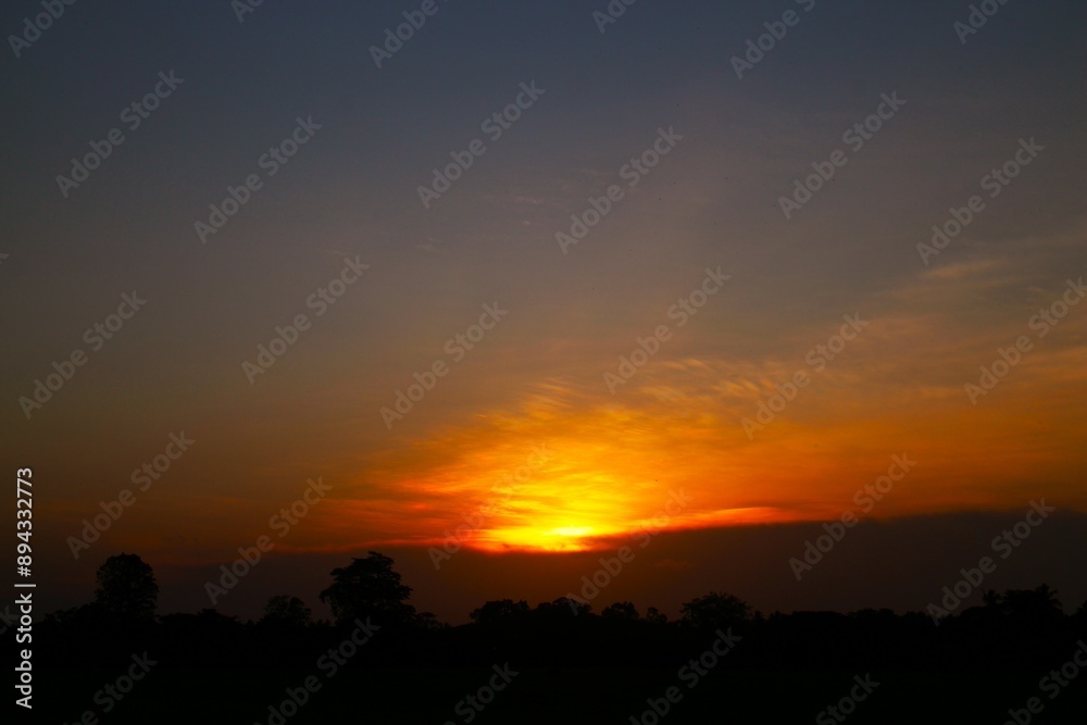 Obraz premium Sunset Sky Clouds in the evening with Red, Orange, Yellow and purple sunlight on Golden hour after sundown, Romantic sky in summer on Dusk Twilight. heart sky.