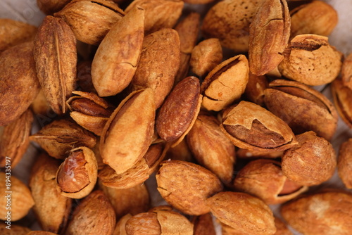 roasted almonds. Almonds are part of the Prunoidae subfamily of the Rosaceae family. This plant is in the same classification as peaches in the subgenus Amygdalus within Prunus. Prunus dulcis photo