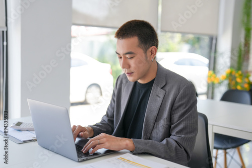 Business man working using laptop computer Hands typing keyboard. Professional investor working start up project. business planning in office. Technology business