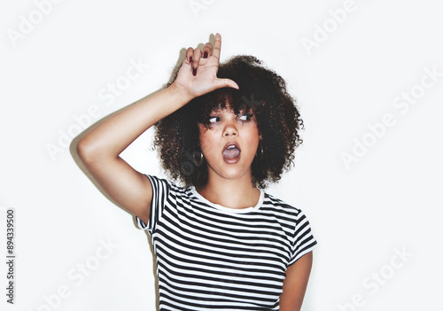 Valokuva Teenager, girl and loser hand sign with wow, gen z gesture and surprise from rumor and gossip