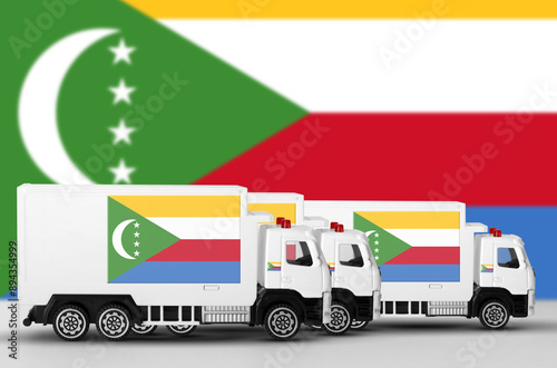 Comoros flag depicted on side wall of white delivery van close up. Shipping and local delivery concept photo