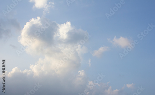 Canvas Print It's a blue sky with atmospheric puffy clouds