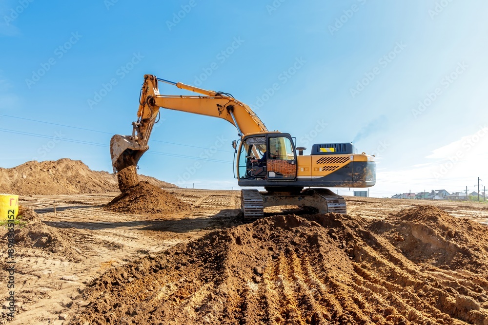 Yellow Excavator at Construction Site. Yellow Excavator at Construction Site.