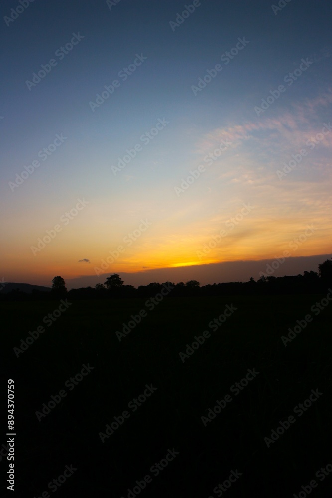 Sunset Sky cloud in the Morning Sunrise with Orange, Yellow Golden Hour Sunrise on Summer season, Horizon Dusk Sky Dramatic Nature Background Sunset Sky cloud in the Morning Sunrise with Orange, Yellow Golden Hour Sunrise on Summer season, Horizon Dusk Sky Dramatic Nature Background