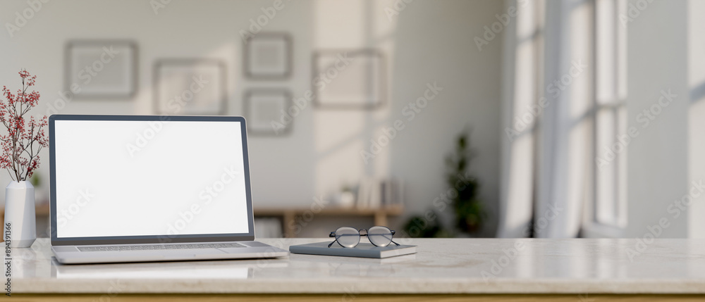 A laptop computer mockup, eyeglasses, and a book on a white marble table in a minimal white room. A laptop computer mockup, eyeglasses, and a book on a white marble table in a minimal white room.