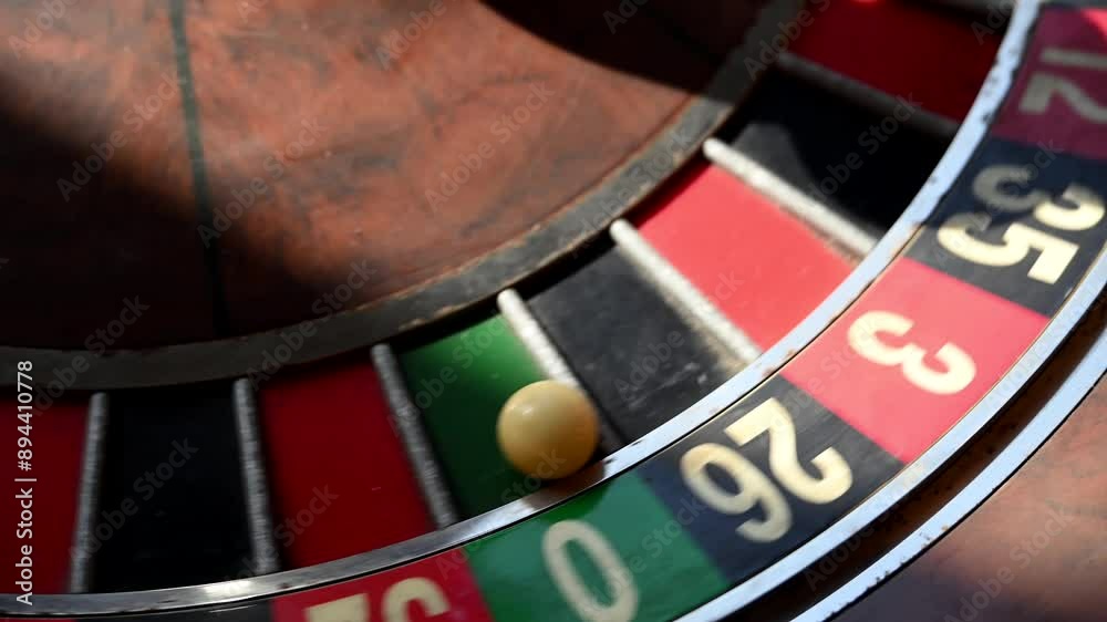 A close-up view of an old roulette wheel spinning, showcasing its classic design and the thrill of the game A close-up view of an old roulette wheel spinning, showcasing its classic design and the thrill of the game