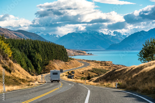 Road trip of Mt Cook over winding road with motorhome driving on sunny day at Peters lookout, New Zealand