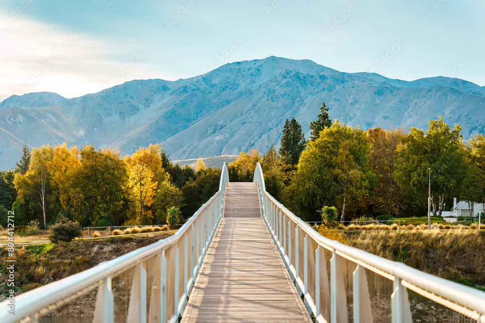 Arch bridge over Lake Tekapo in autumn forest at New Zealand Arch bridge over Lake Tekapo in autumn forest at New Zealand