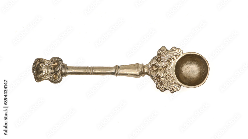 antique handcrafted bronze spoon used for pooja rituals isolated on white background antique handcrafted bronze spoon used for pooja rituals isolated on white background