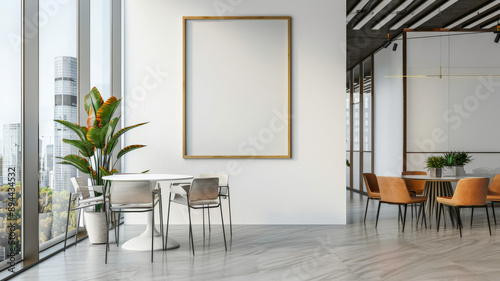 An empty poster frame hangs on a sleek white wall in a modern office interior, surrounded by minimalist furniture and large windows letting in natural light.