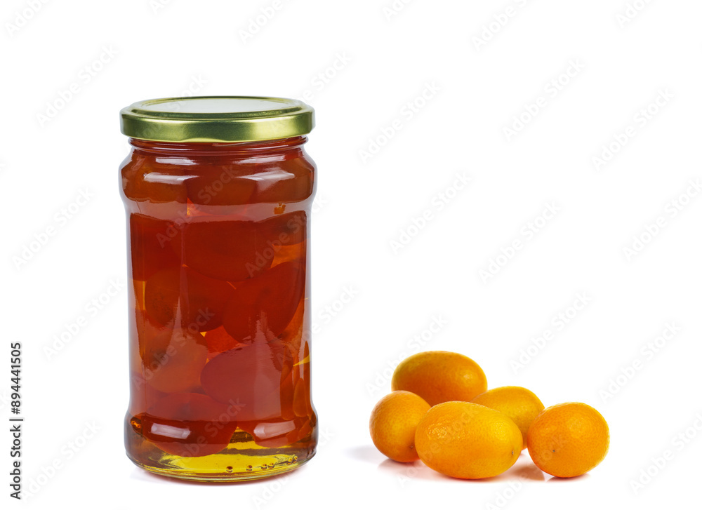 Cumquat or kumquat jam in glass jare and fresh berries isolated on white background Cumquat or kumquat jam in glass jare and fresh berries isolated on white background