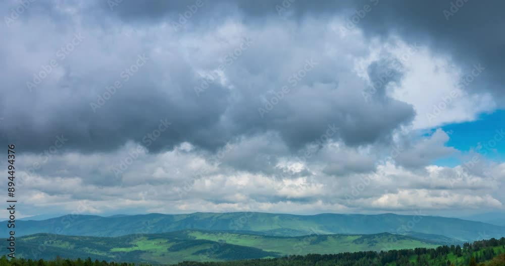 Mountain lake time-lapse at the summer or autumn time. Wild nature and rural field. Fast clouds movement, green grass and dramatic sky. Motorised dolly slider movement Mountain lake time-lapse at the summer or autumn time. Wild nature and rural field. Fast clouds movement, green grass and dramatic sky. Motorised dolly slider movement