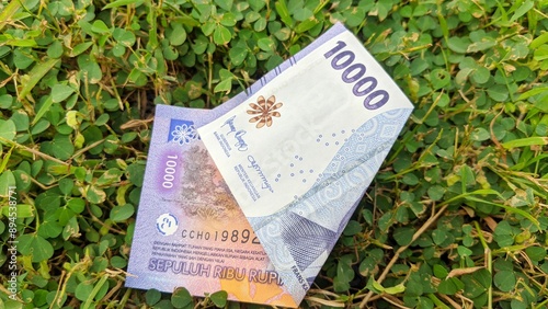 Indonesian currency denominated in 10000 rupiah or 10k rupiah. photo