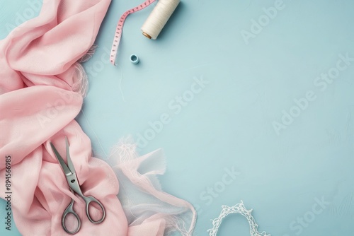 A photo of sewing and tailoring items laid out on a table, including spools of thread, lace and ribbon. Space for copy. Sewing and hobby concept. 