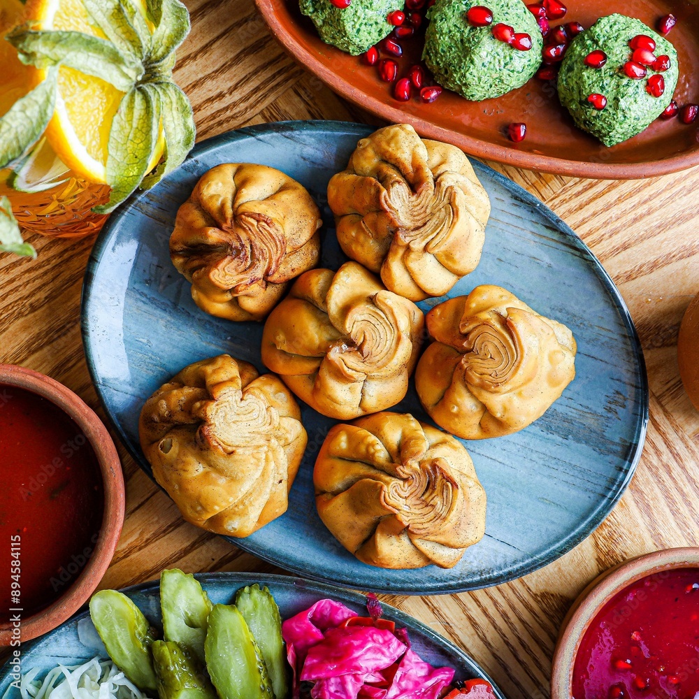 Fried Khinkali Dumplings on Blue Plate Fried Khinkali Dumplings on Blue Plate