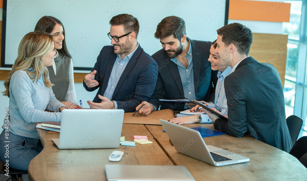 Group of coworkers interacting in the office Group of coworkers interacting in the office