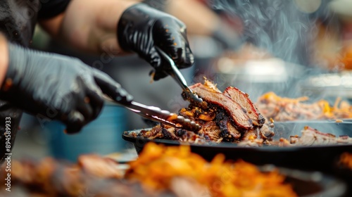 A chef wearing black gloves slices and serves smoked brisket on a tray with smoke rising, showcasing the delicious display at an outdoor food festival. photo