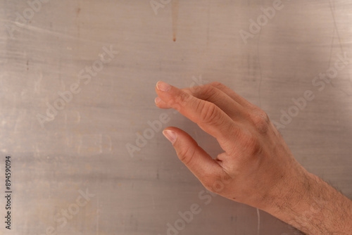A hand reaching out towards...