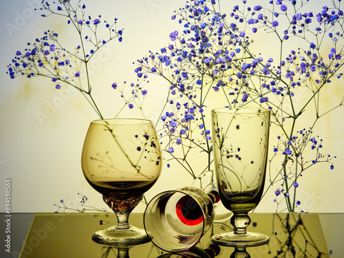 Still life -  three glasses and blossom branch