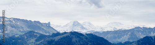 View of Eiger, Mönch, and Jungfrau Peaks in Swiss Alps in May