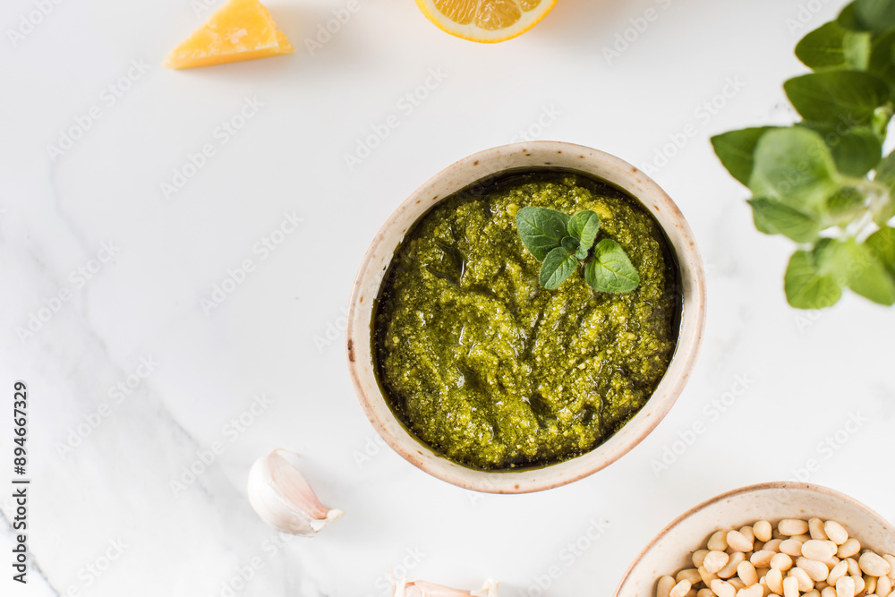 Fresh homemade pesto sauce in a bowl. Italian cuisine. Recipe. Copy space Fresh homemade pesto sauce in a bowl. Italian cuisine. Recipe. Copy space