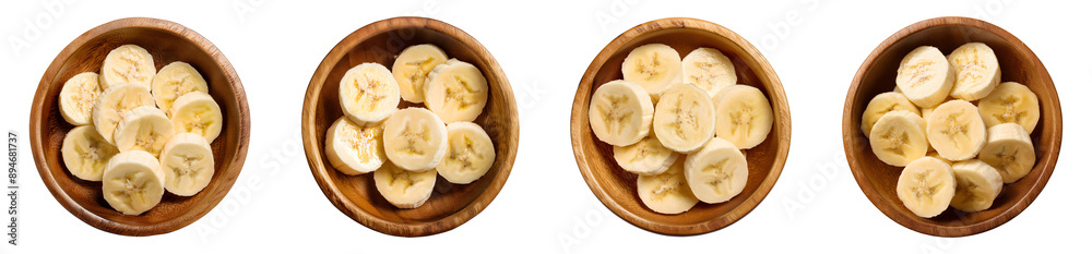 Banana slices on wooden bowl top view isolated Banana slices on wooden bowl top view isolated