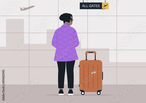 A lone traveler stands with their luggage, facing away from the camera, waiting patiently at an airport gate, An airplane flies overhead, signaling the imminent start of their journey