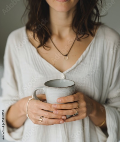 Woman Holding a Cup of Coffee