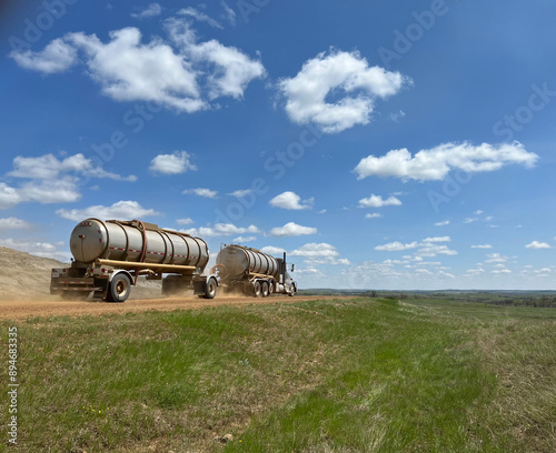 A tanker truck hauls oil along a scoria road in the Bakken in North Dakota