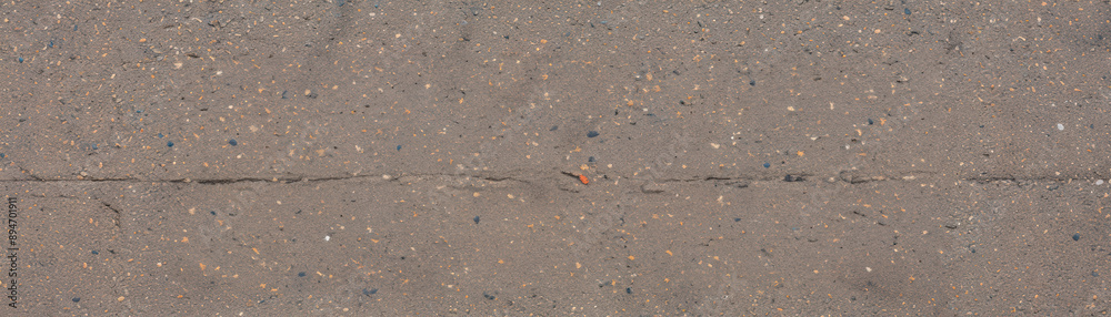 Close-up of a textured sidewalk surface with visible cracks and small pebbles, showing the urban environment and natural colors. Close-up of a textured sidewalk surface with visible cracks and small pebbles, showing the urban environment and natural colors.