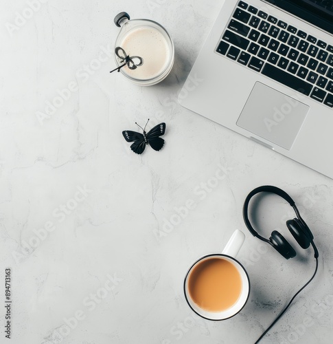 Laptop, Headphones, and Coffee in a Cafe