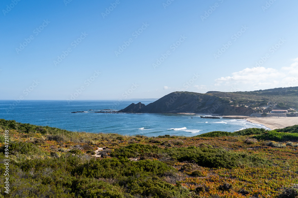 Beautiful beach and cliff on the west coast of Algarve. Amoreira beach, in Aljezur, Costa Vicentina. Surfing in Portugal. Beautiful beach and cliff on the west coast of Algarve. Amoreira beach, in Aljezur, Costa Vicentina. Surfing in Portugal.