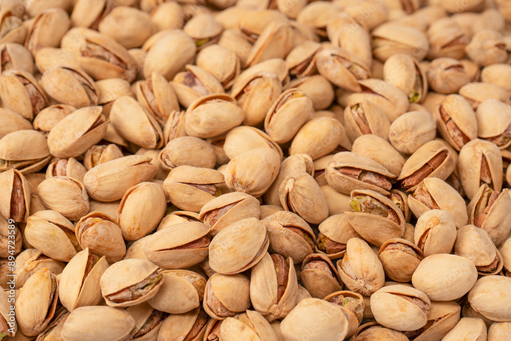 Tasty pistachios isolated on a white background. Tasty pistachios isolated on a white background.
