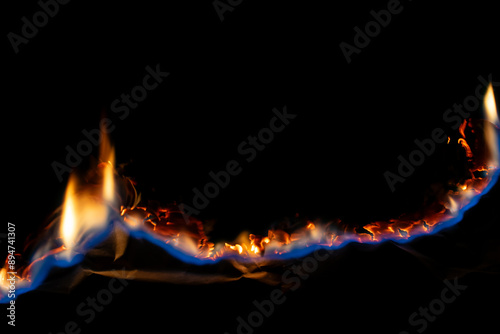 Canvastavla burning paper, glowing edge of paper on a black background.