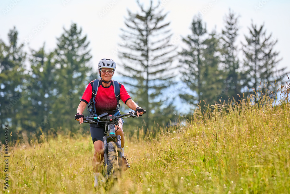 nice active senior woman riding her electric mountain bikeon Salmas summit in Oberstaufen, Allgaeu Alps , Bavaria, Germany
nice active senior woman riding her electric mountain bikeon Salmas summit in Oberstaufen, Allgaeu Alps , Bavaria, Germany